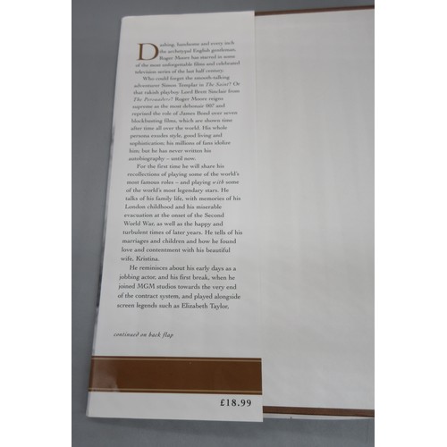 435 - James Bond memorabilia to incl. signed Roger Moore 'My Word is my Bond' book, large Moonraker film p... 