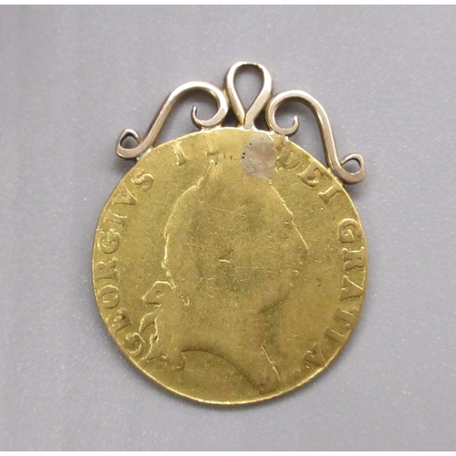 4A - George III (1760-1820) 1788 spade half Guinea with applied yellow metal mount to top, with drilled h... 