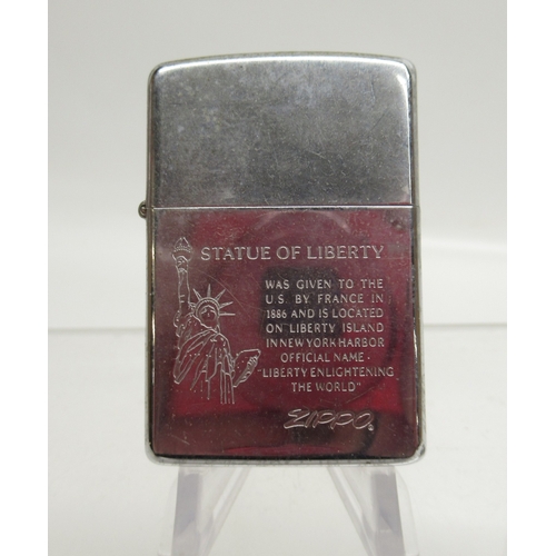 312 - Zippo 'Statue of Liberty' lighter and eight other Zippo lighters

Bradley's shipping £33.00 plus vat... 