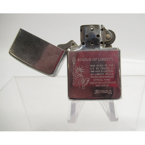 312 - Zippo 'Statue of Liberty' lighter and eight other Zippo lighters

Bradley's shipping £33.00 plus vat... 