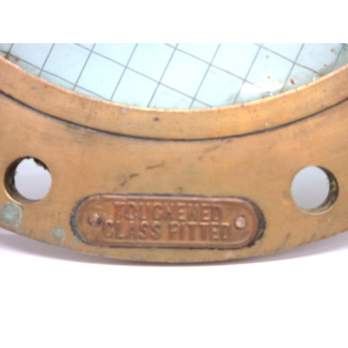 693 - Salvaged brass ship's porthole/side scuttle of typical, rounded, heavy cast construction featuring t... 