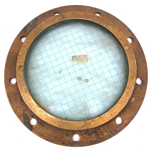 693 - Salvaged brass ship's porthole/side scuttle of typical, rounded, heavy cast construction featuring t... 