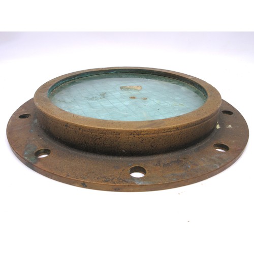 693 - Salvaged brass ship's porthole/side scuttle of typical, rounded, heavy cast construction featuring t... 