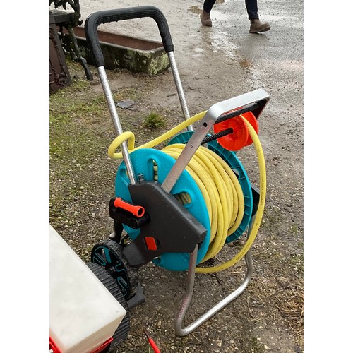 888 - Pull along vehicle powered aerator/cultivator with seed box and a large hose pipe on reel with troll... 