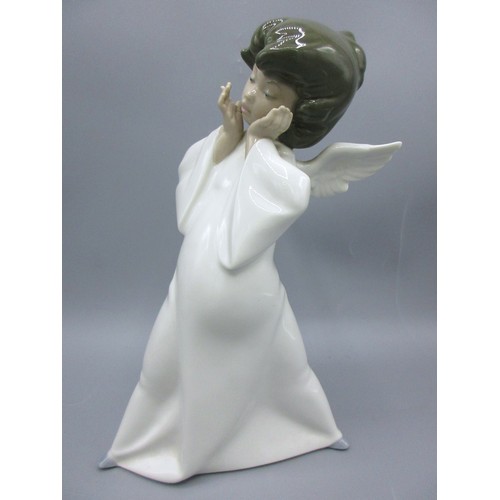874 - Three Lladro porcelain angelic figures inc. 'Mime Angel' (no. 4959) depicted standing with a puzzled... 