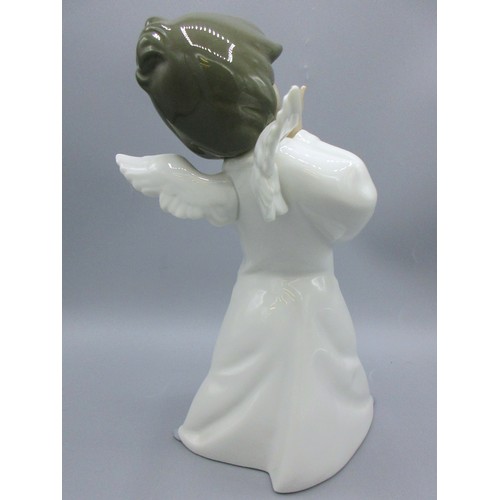 874 - Three Lladro porcelain angelic figures inc. 'Mime Angel' (no. 4959) depicted standing with a puzzled... 