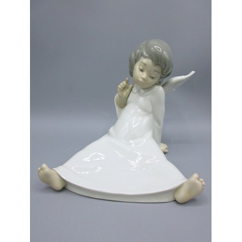 874 - Three Lladro porcelain angelic figures inc. 'Mime Angel' (no. 4959) depicted standing with a puzzled... 