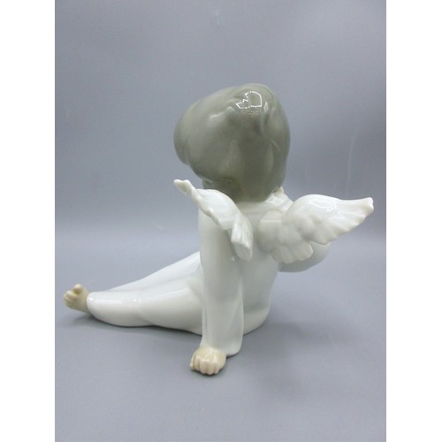 874 - Three Lladro porcelain angelic figures inc. 'Mime Angel' (no. 4959) depicted standing with a puzzled... 