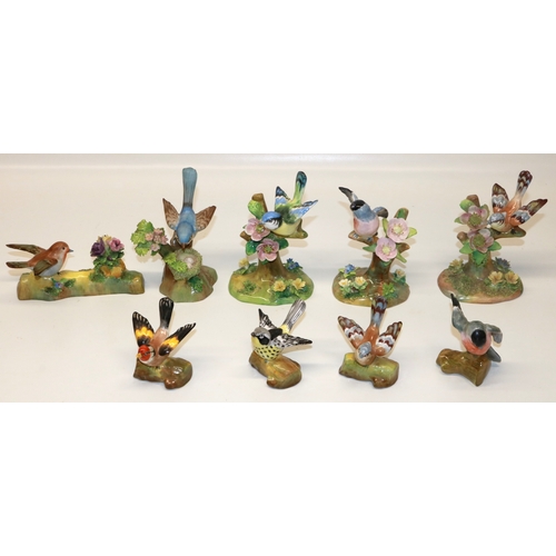 870 - Collection of Crown Staffordshire birds, modelled by J T Jones, max. H14cm (9)

Bradleys Shipping £5... 