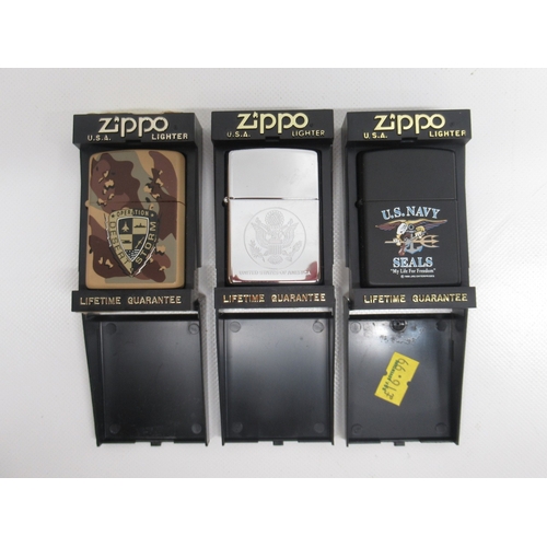 299 - Zippo 'Operation Desert Storm' camouflage lighter'; Zippo 'United States of America' chrome lighter ... 