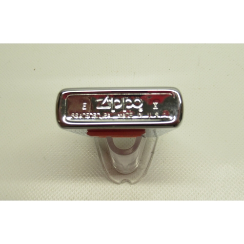 299 - Zippo 'Operation Desert Storm' camouflage lighter'; Zippo 'United States of America' chrome lighter ... 