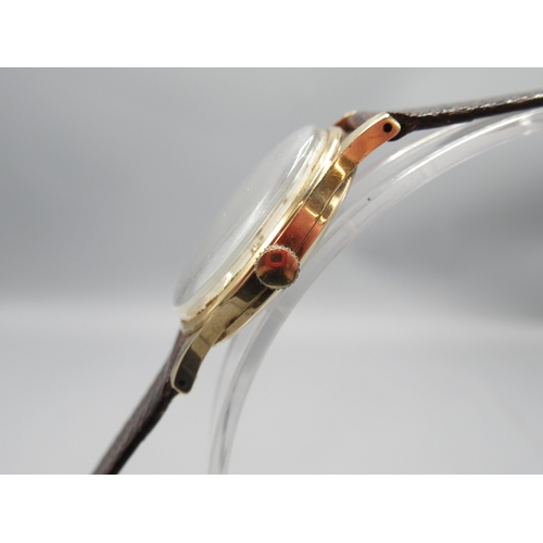 271 - Rotary 9ct gold wristwatch on brown leather strap, signed silver dial with Arabic and baton indices ... 