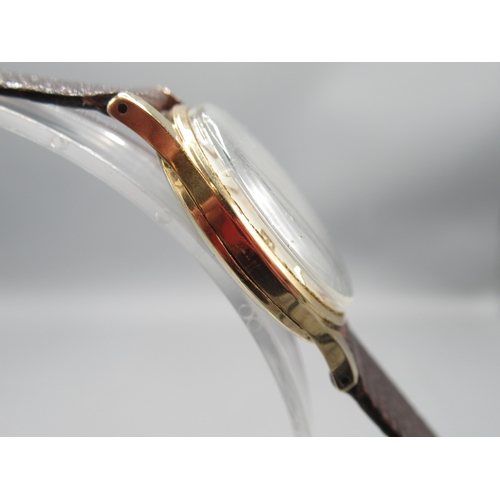 271 - Rotary 9ct gold wristwatch on brown leather strap, signed silver dial with Arabic and baton indices ... 