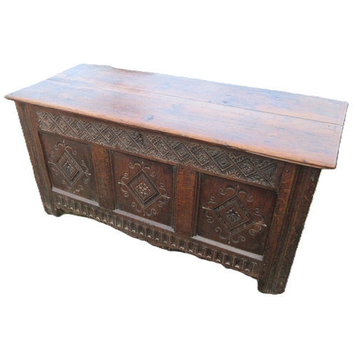 353 - 18th century oak coffer, planked top and three  lozenge carved panel front, W137cm D57cm H66cm

Ship... 