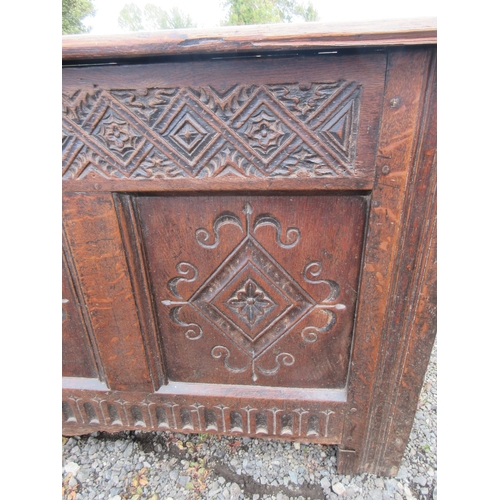 353 - 18th century oak coffer, planked top and three  lozenge carved panel front, W137cm D57cm H66cm

Ship... 