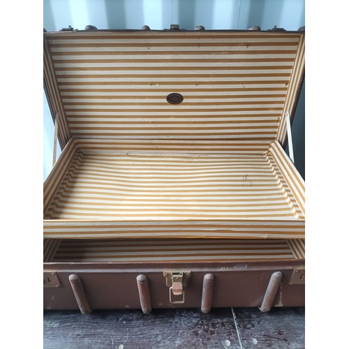 389 - Two trunks: One green metal with red stripe and brass corner detailing. One wood 