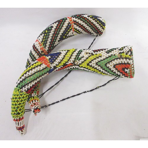 860 - African mask, beaded horns, springbok hide, flag, and salt and pepper shakers  Bradleys shipping £48... 