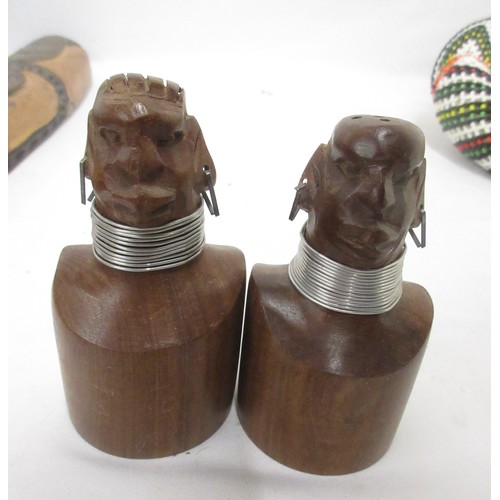 860 - African mask, beaded horns, springbok hide, flag, and salt and pepper shakers  Bradleys shipping £48... 