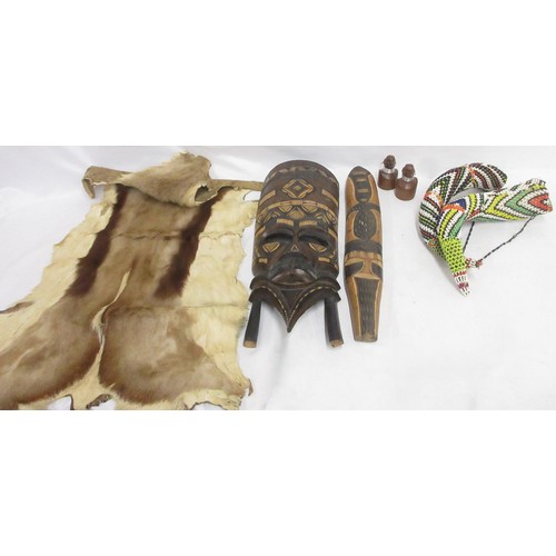 860 - African mask, beaded horns, springbok hide, flag, and salt and pepper shakers  Bradleys shipping £48... 