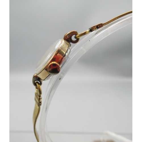 324 - Hamilton ladies gold plated wristwatch on rolled gold bracelet, signed silver dial with Arabic and b... 