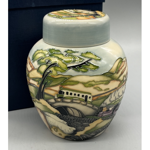 486 - Moorcroft Pottery ginger jar with lid, piped rural scene of a train and a bus travelling across moor... 