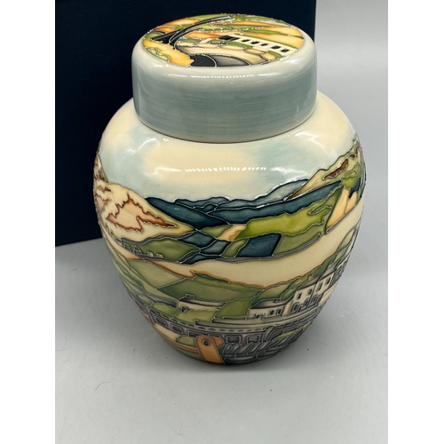 486 - Moorcroft Pottery ginger jar with lid, piped rural scene of a train and a bus travelling across moor... 