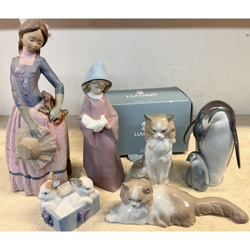 751 - Lladro figure of two penguins, with box, and a collection of Nao figures incl. a large Gres figure (... 