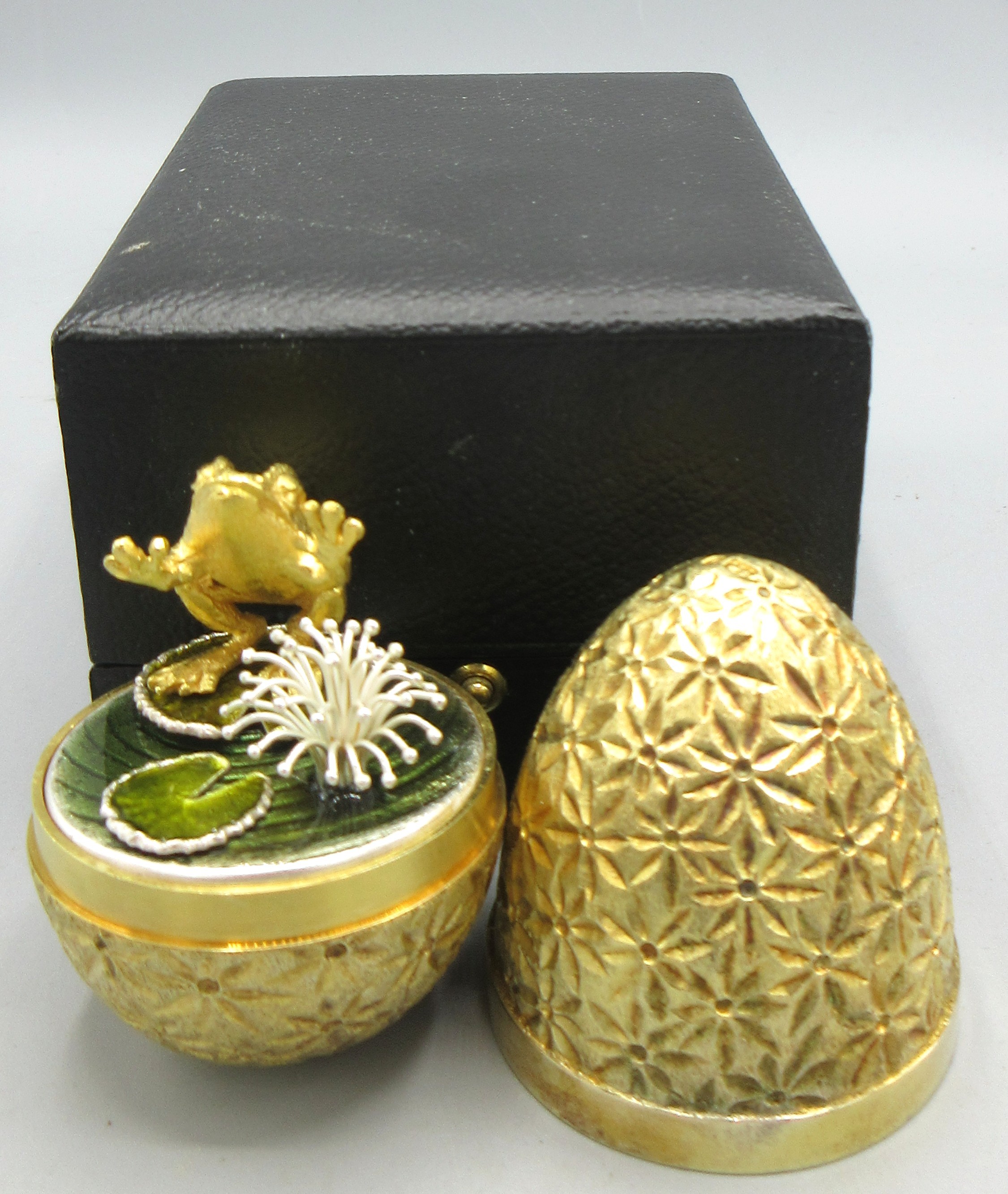Stuart Devlin gilt silver surprise egg, 1978, opening to reveal frog on ...