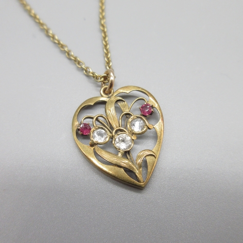 33 - Edwardian style 15ct yellow gold heart shaped pendant set with rubies and clear stones, stamped 15ct... 