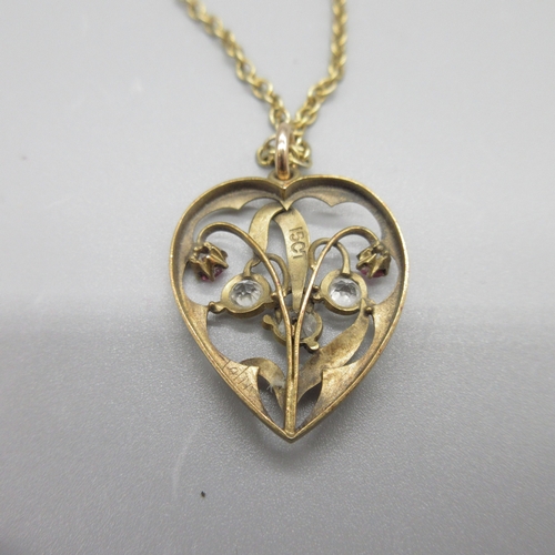 33 - Edwardian style 15ct yellow gold heart shaped pendant set with rubies and clear stones, stamped 15ct... 