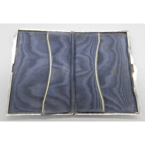 47 - Victorian silver card case with engraved scrolling covers, vacant cartouche, fitted fabric interior,... 