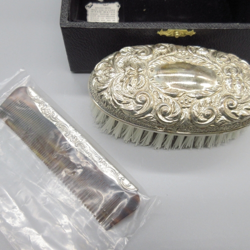 52 - 20th century silver mounted brush and comb, decorated with scrolling foliate repousse by W I Broadwa... 