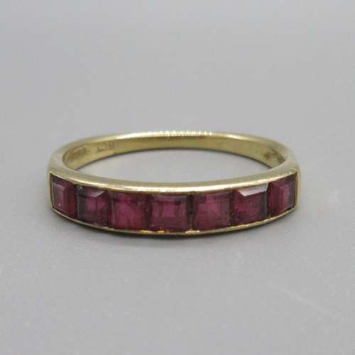 75 - 18ct yellow gold seven stone ruby ring, stamped 18ct, size O, 2.46g

Bradley's shipping £20.00 plus ... 