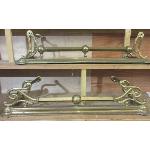 205 - Two late Victorian brass fenders, with scroll and ball decoration, approx W132cmn D36cm H30cm (2)

B... 