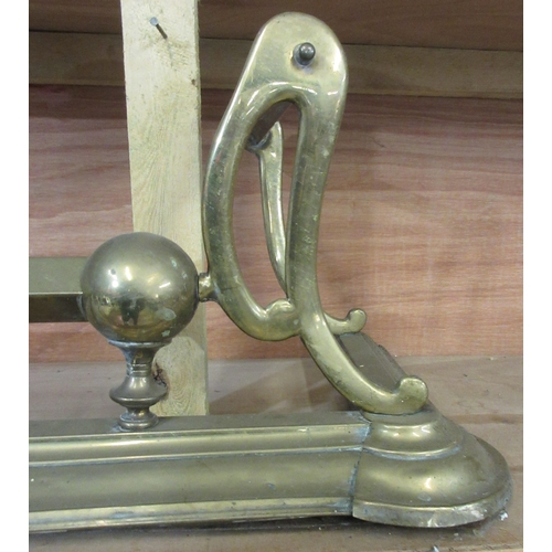 205 - Two late Victorian brass fenders, with scroll and ball decoration, approx W132cmn D36cm H30cm (2)

B... 