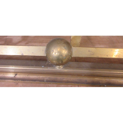 205 - Two late Victorian brass fenders, with scroll and ball decoration, approx W132cmn D36cm H30cm (2)

B... 