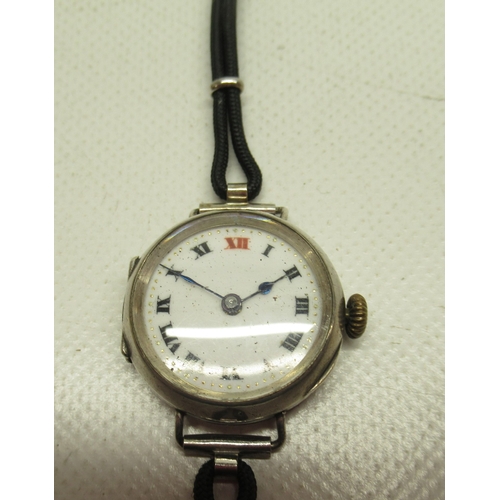 222 - Swiss ladies silver trench type wristwatch on cord strap, white enamel Roman dial with red 'XII', hi... 