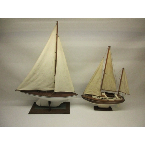 151 - Two mid-century pond yachts with a spare set of sails, L64cm (2)  Shipping POA https://www.bradleys.... 