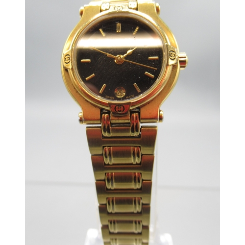 1294 - Gucci ladies gold plated quartz wristwatch with date on matching H link bracelet signed butterfly cl... 