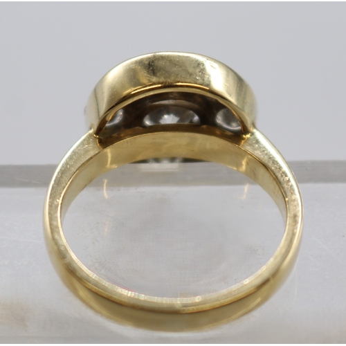 1283 - 18ct stamped diamond target ring comprising 1 large cental stone approx. 1ct and 8 smaller stones ap... 