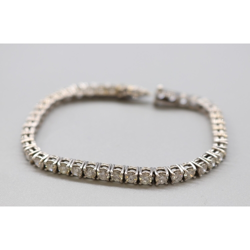 1293 - Multi-stone diamond white metal tennis bracelet, L 16.5cm

Bradley's shipping &pound;23.00 plus vat (UK On...