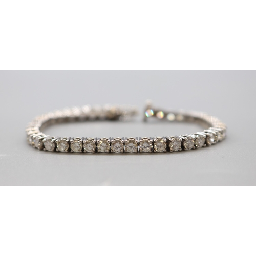 1293 - Multi-stone diamond white metal tennis bracelet, L 16.5cm

Bradley's shipping £23.00 plus vat (UK On... 