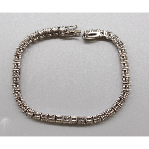 1293 - Multi-stone diamond white metal tennis bracelet, L 16.5cm

Bradley's shipping £23.00 plus vat (UK On... 
