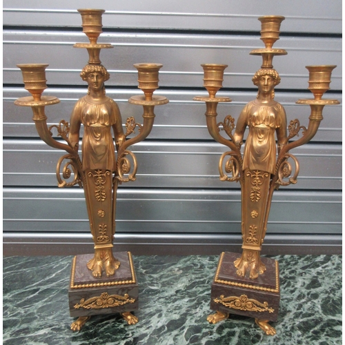 1387 - Pair of Regency style gilt metal figural candelabra, on marble bases with paw feet, H45cm (2)

Bradl... 