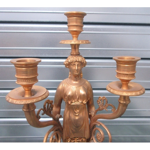 1387 - Pair of Regency style gilt metal figural candelabra, on marble bases with paw feet, H45cm (2)

Bradl... 