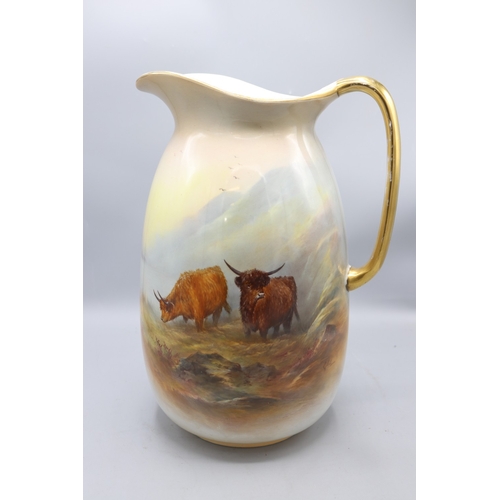 654 - Large Crown Devon jug painted with Highland cattle, signed G. Cox, gilt rim and handle, H33.5cm

Bra... 