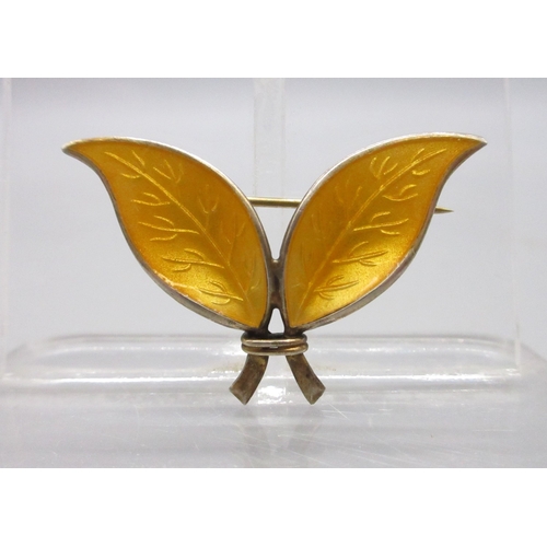 169 - David Andersen, Norwegian sterling silver and yellow enamel brooch (4.7g)

Bradley's shipping £23.00... 
