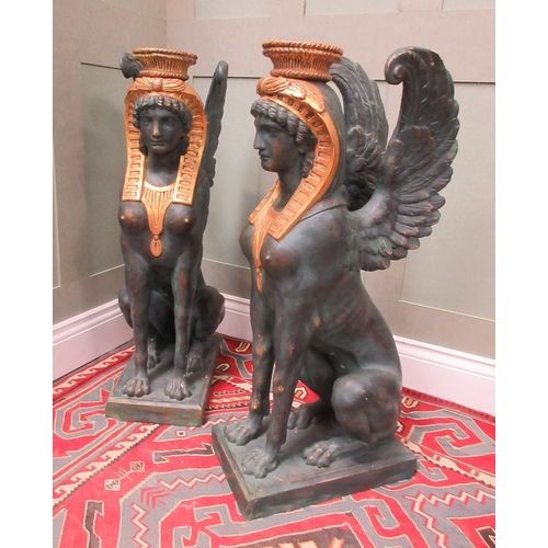 1377 - Style of S. Chenu - a pair of Egyptian Revival style composite Sphinx pier table supports, on rectan... 