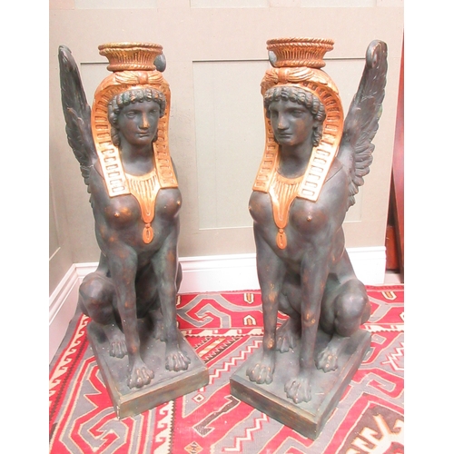 1377 - Style of S. Chenu - a pair of Egyptian Revival style composite Sphinx pier table supports, on rectan... 