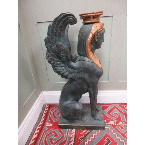 1377 - Style of S. Chenu - a pair of Egyptian Revival style composite Sphinx pier table supports, on rectan... 